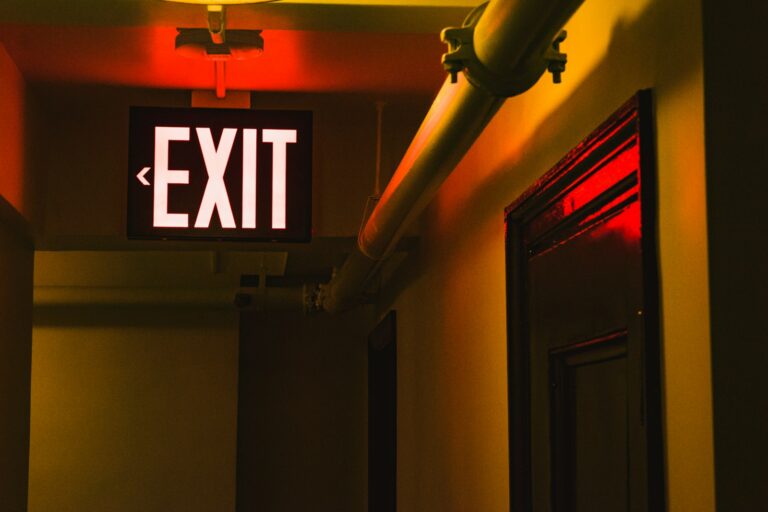 Close-up of a red LED emergency exit sign